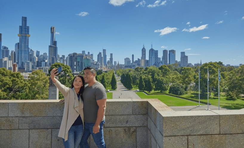 A couple take a selfie from the Shrine's balcony