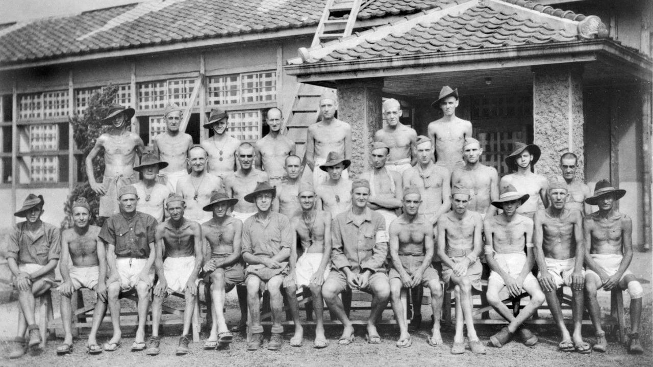 Australian prisoners of war pose for a group portrait six weeks after peace was declared at Fukuoka Branch Camp 26 Z.