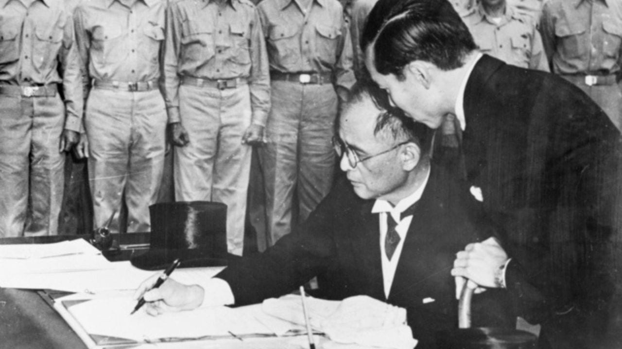 Japanese Foreign Minister Mr Shigemitsu signing the instrument of surrender aboard USS Missouri, 1945