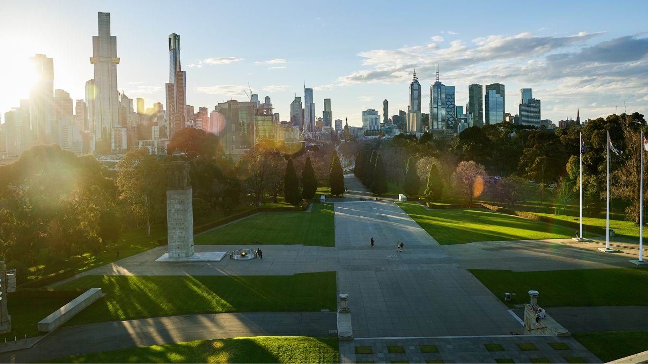 View across the Second World War Memorial Forecourt at dusk, looking towards the city