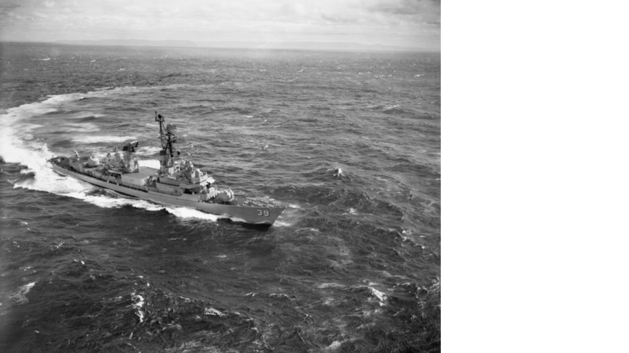Black and white image of HMAS Hobart at sea off the coast of Vietnam, 1967