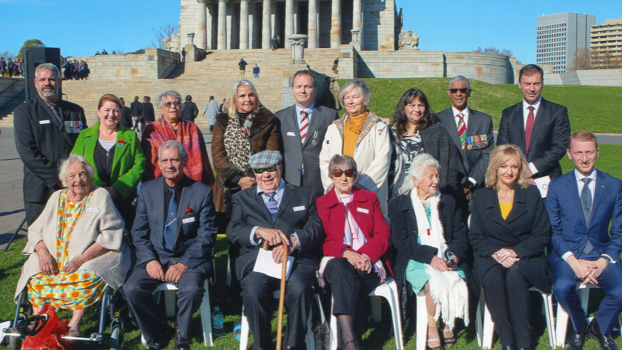 A group of people in front of the Shrine of Remembrance at the Victorian Aboriginal Remembrance Service in 2016.